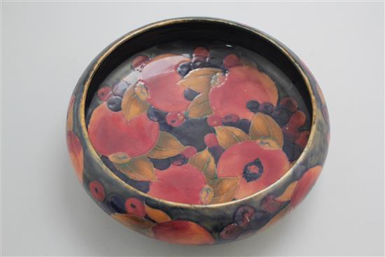 A William Moorcroft pomegranate pattern Tudric pewter mounted bowl, c.1920, 22cm, mount loose
